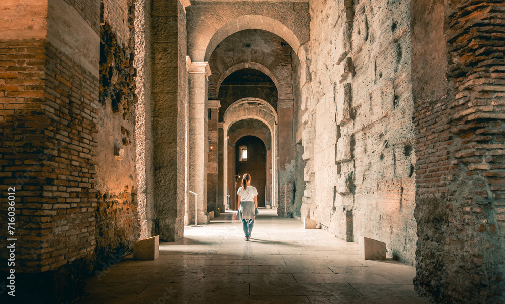 Wanderlust Travelling Girl walking in Roman Colosseum and Forum in Rome, Italy