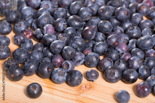 Juicy fresh blueberries on wooden table