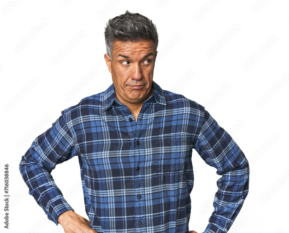 Middle-aged Latino man confused, feels doubtful and unsure. Middle-aged Latino man confused, feels doubtful and unsure.