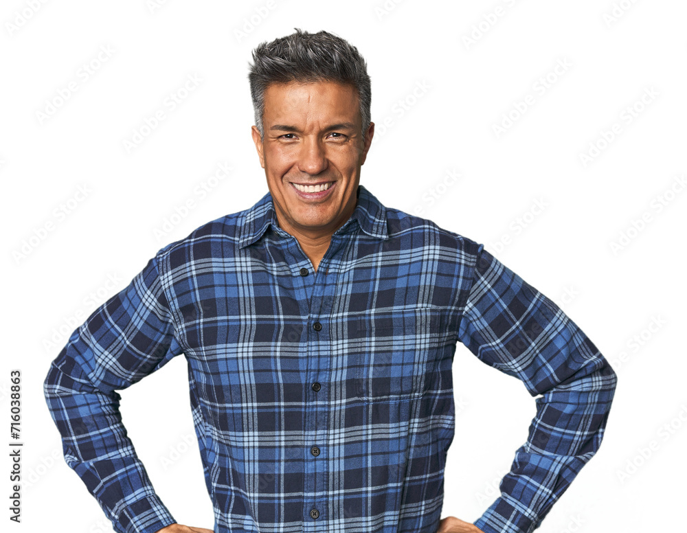 Middle-aged Latino man confident keeping hands on hips. Middle-aged Latino man confident keeping hands on hips.