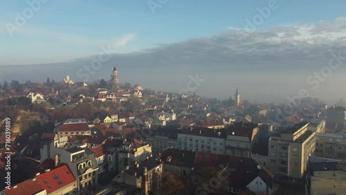 Drone flight above the church in the smog and fog in the morning. Zemun and New Belgrade district, Belgrade, Serbia, Europe. photo