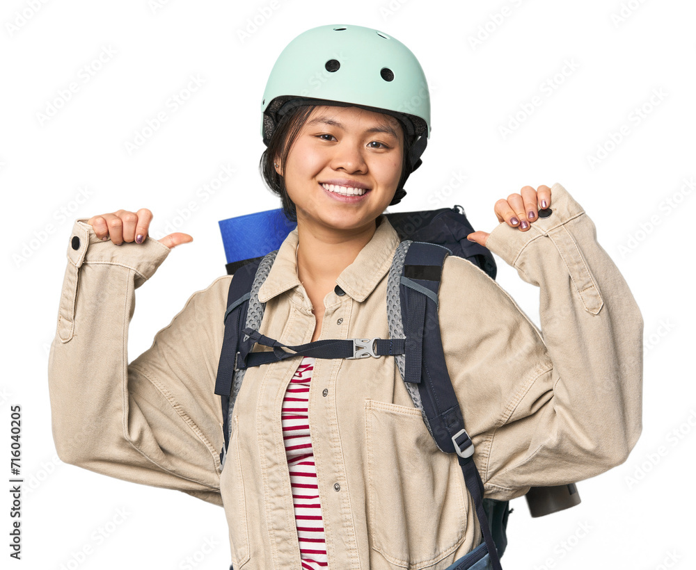 Chinese woman geared up for mountain activities feels proud and self confident, example to follow. Chinese woman geared up for mountain activities feels proud and self confident, example to follow.
