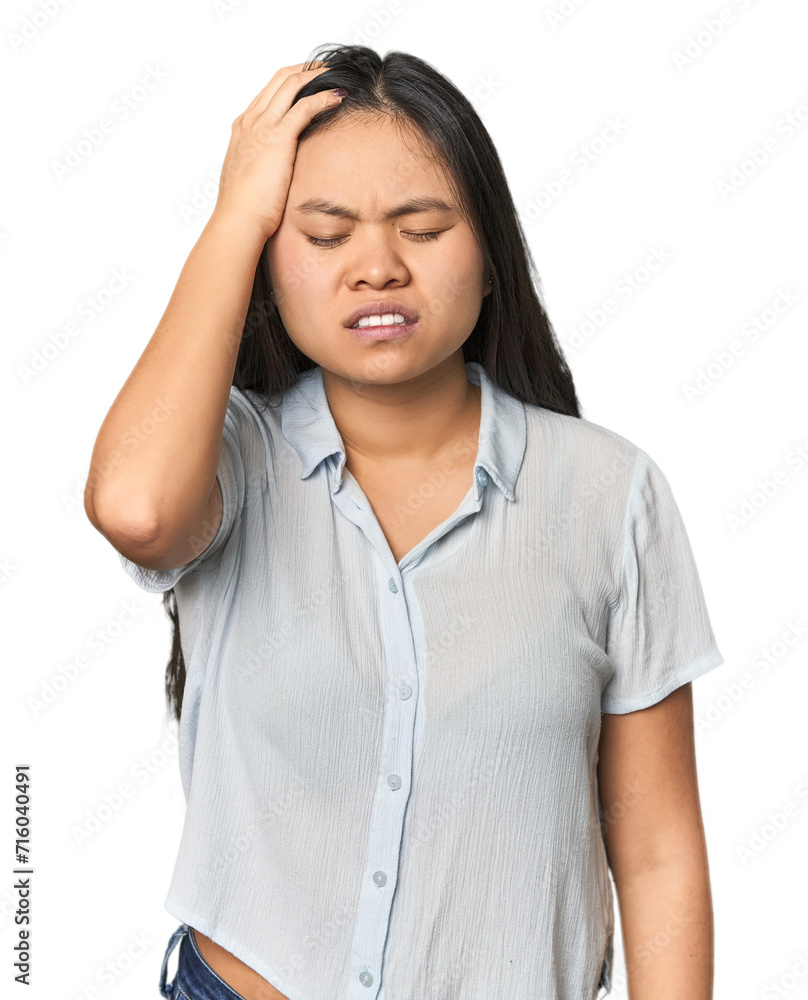 Young chinese woman isolated tired and very sleepy keeping hand on head. Young chinese woman isolated tired and very sleepy keeping hand on head.
