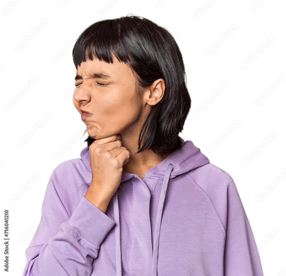Young Hispanic woman with short black hair in studio suffers pain in throat due a virus or infection. Young Hispanic woman with short black hair in studio suffers pain in throat due a virus or infection.