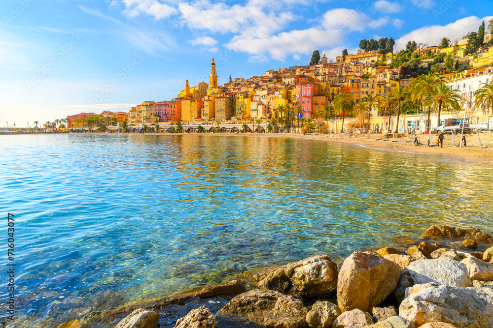 Townscape of the picturesque and colorful old town and Les Sablettes Beach and promenade along the Cote d'Azur French Riviera at Menton, France.