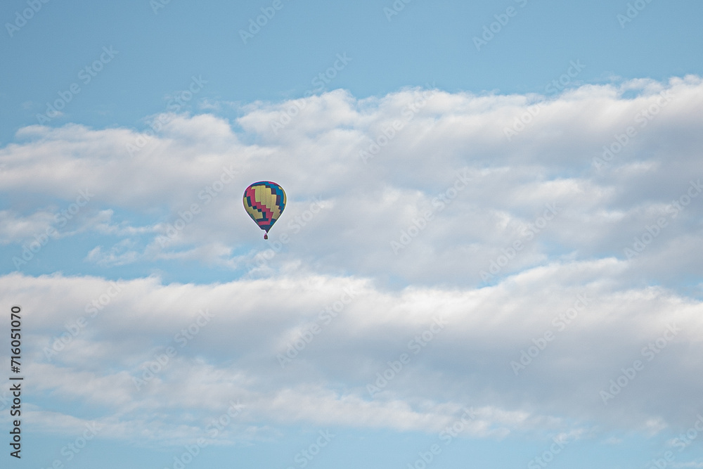 Fototapeta premium colorful hot air balloon in cloudy sky