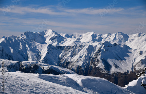 Picturesque view snowy mountain peaks. The Alps at the Meribel ski area in France. © FashionStock