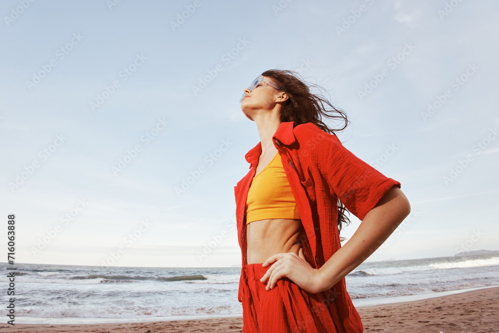Happy Woman Enjoying Freedom and Beauty of Summer Vacation at the Beach Happy Woman Enjoying Freedom and Beauty of Summer Vacation at the Beach