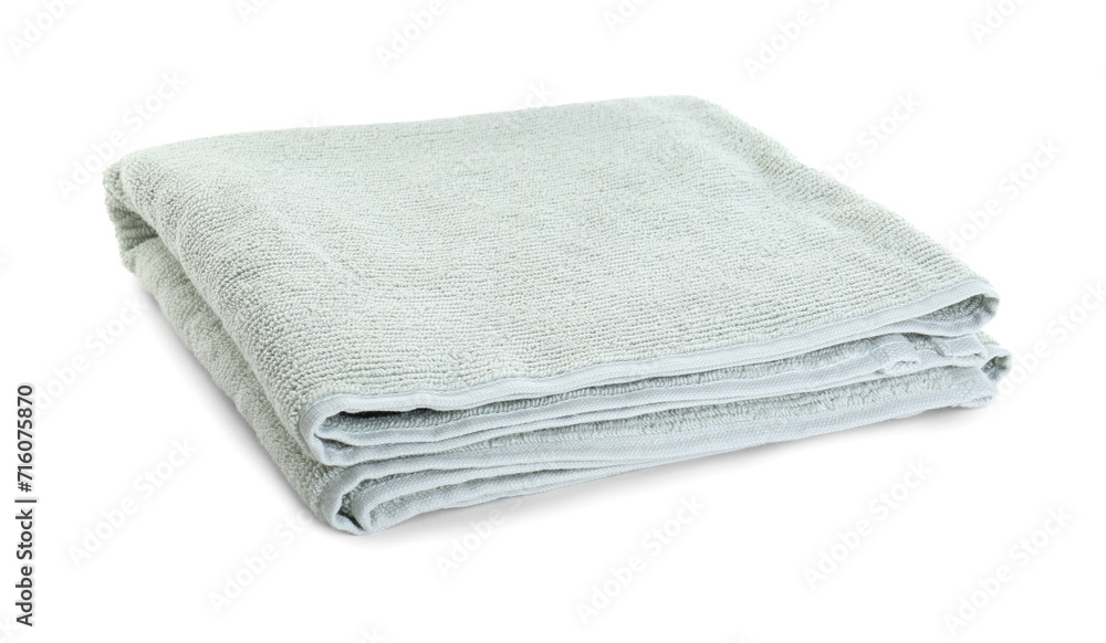 One soft folded towel isolated on white One soft folded towel isolated on white