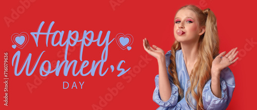 Beautiful young girl dressed as doll with chewing gum on red background. Greeting banner for Women's Day