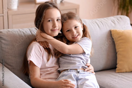 Cute little sisters hugging...
