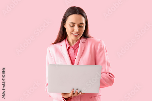 Young woman in stylish suit...