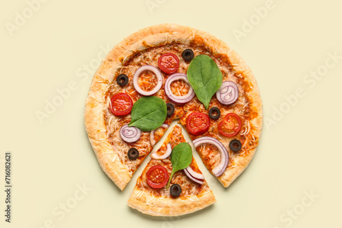 Tasty pizza with basil and tomatoes on green background