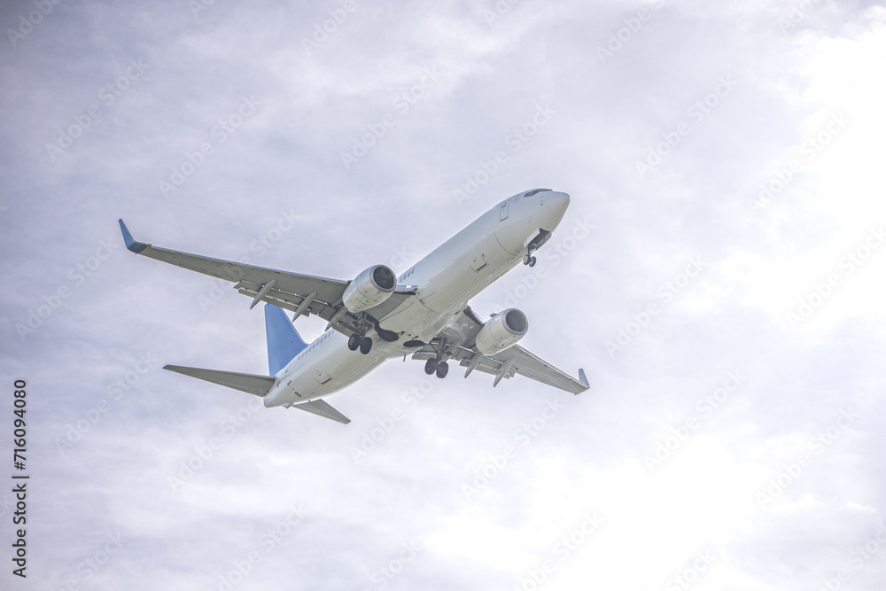 A low-altitude passenger plane near the runway A low-altitude passenger plane near the runway
