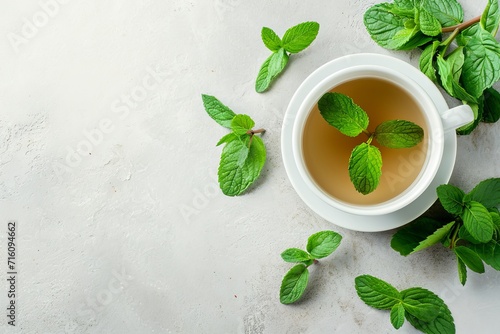 Top view of fresh mint tea and mint leaves in a mug Empty space