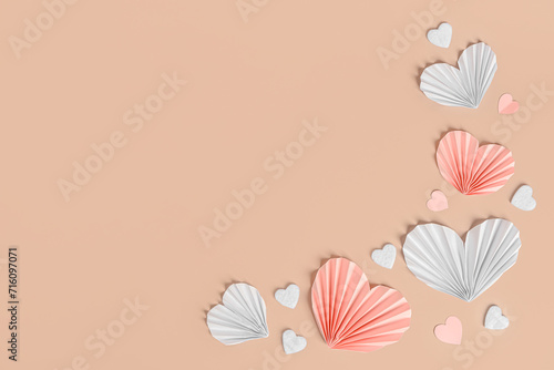 Paper and felt hearts on beige background © Pixel-Shot
