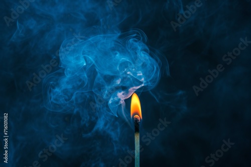 Lighting a match in smoky darkness