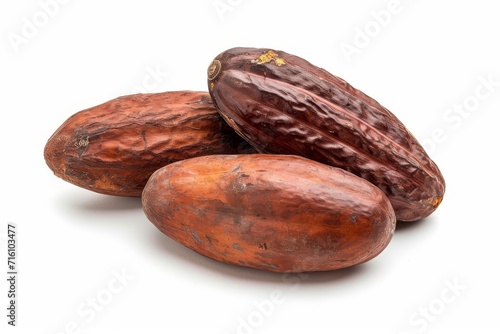 Three isolated Cocoa beans on white background