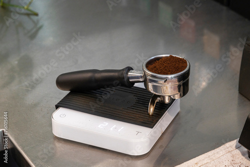 Portafilter on Scales with Freshly Ground Coffee