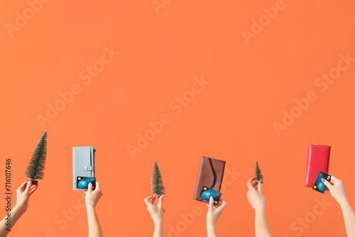 Hands holding credit cards,...