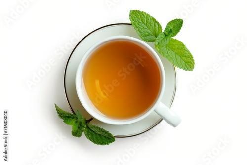 Top view of isolated white cup filled with hot mint tea