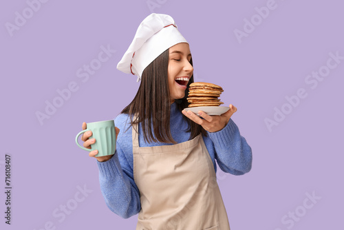 Young female chef with tast...
