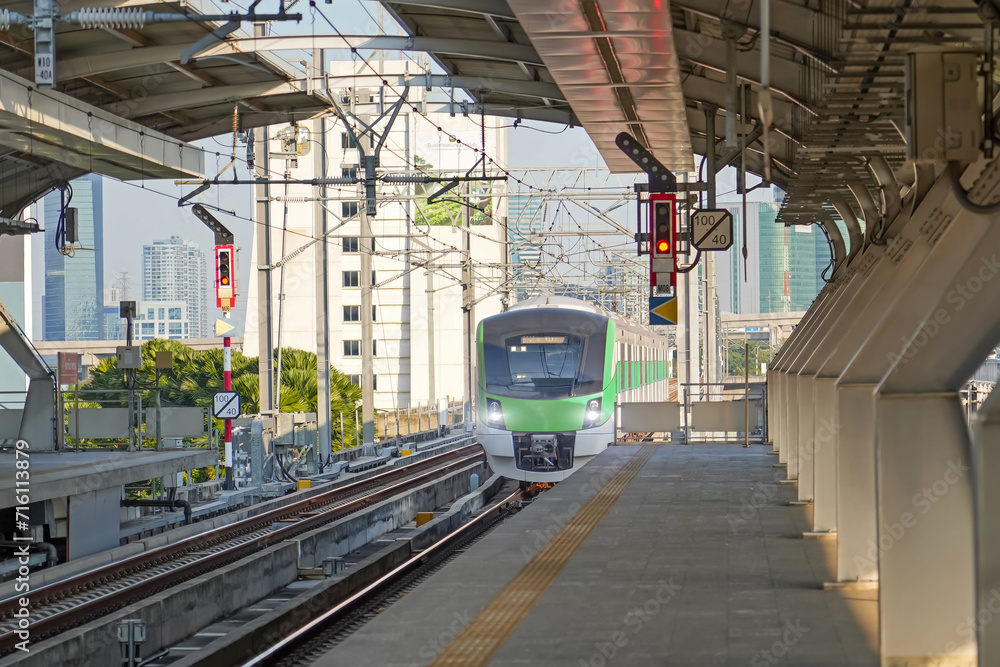 Naklejka premium Suburban high speed passenger train arrives stop at the station. The concept of modern comfortable fast passenger transportation in the region