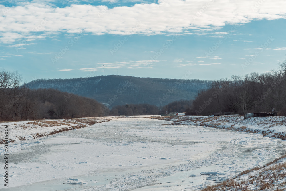 Frozen over river extreme cold weather copy space winter landscape background Frozen over river extreme cold weather copy space winter landscape background
