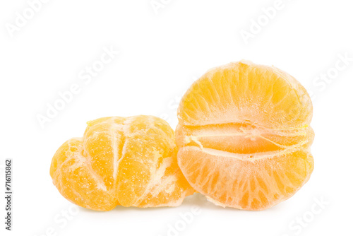 Halves of sweet mandarin on white background