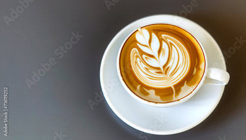 
Fresh cappuchino or flat white coffee in a white cup with latte art on it close-up. High quality photo photo
