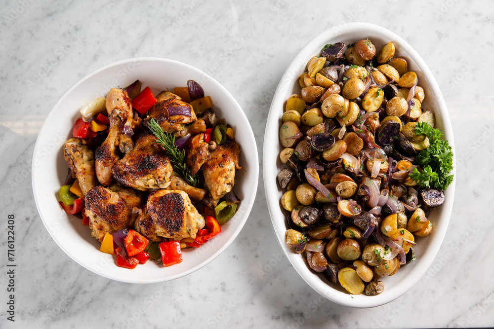 Sharing plates of chicken and olives Sharing plates of chicken and olives