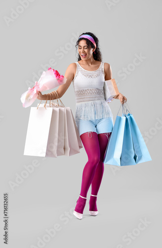 Happy young woman with shop...