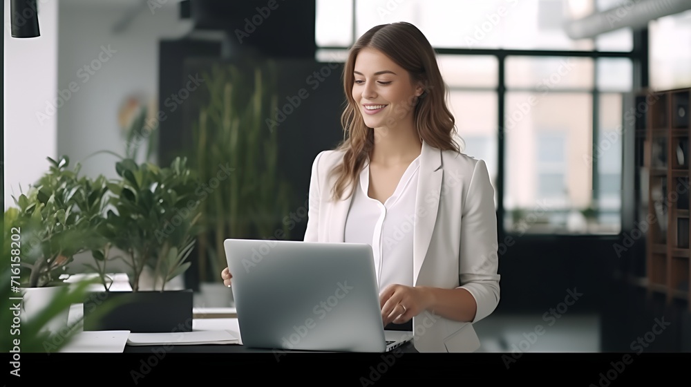 IT Woman Using Laptop in a Technology,Themed Workplace , IT woman, using laptop, technology theme, workplace IT Woman Using Laptop in a Technology,Themed Workplace , IT woman, using laptop, technology theme, workplace