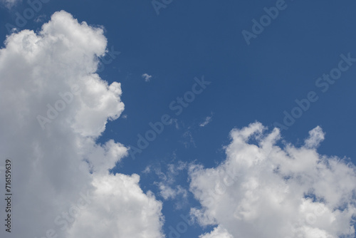The shape of a man and his dog isolated in the clouds image for background use © Richard