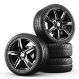 set of four high-performance car tires with sleek black alloy wheels, isolated white background. ideal for automotive advertising and product catalogs