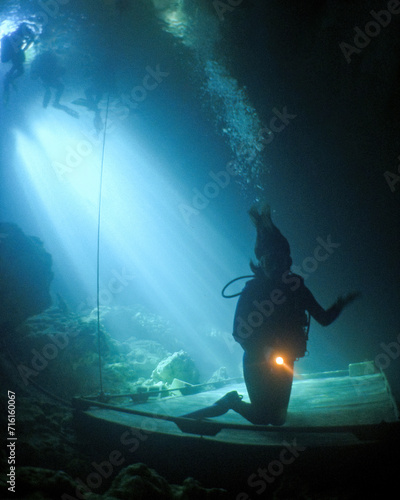 Tableau sur toile A Female Teen Scuba Diver Swims and Trains  at the Devil's Den Cave In Florida