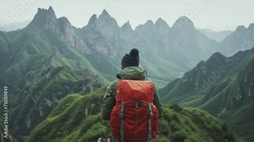 Adventurous man enjoying mountain hiking solo traveling outdoor active vacations traveler backpackin. © Supatsorn