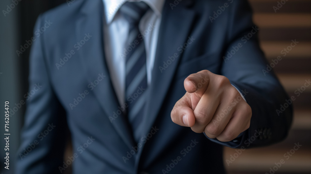 Businessman pointing, giving command, using his hand to show agreement and success.
