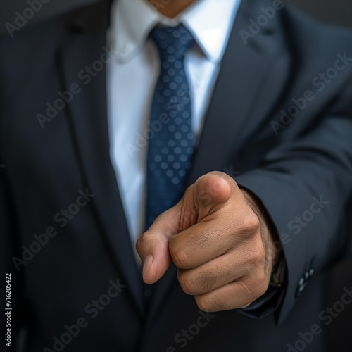 Businessman pointing, giving command, using his hand to show agreement and success.