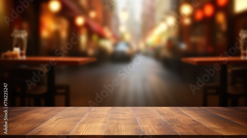 Wooden table with blurry city street in background. Perfect for showcasing modern urban lifestyle