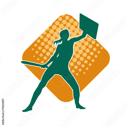 Silhouette of a female fighter in action pose carrying sword weapon.