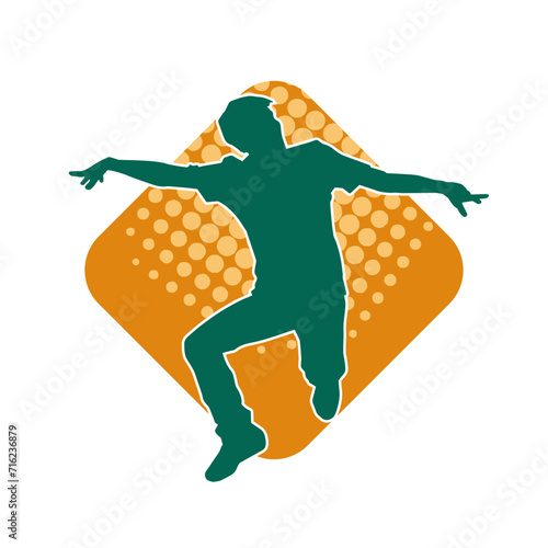 Silhouette of a man in dancing pose. Silhouette of a male dancer in performing pose.