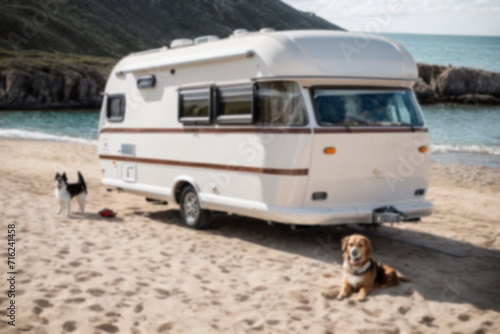 Family vacation with a dogs in a motorhome on the sea beach. Holiday trip in Caravan car .Blurred.