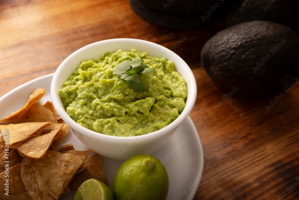 Guacamole. Avocado dip sauce, one of its many ways of consuming it is spread on tortilla chips also called Nachos. Mexican easy homemade sauce recipe very popular. Guacamole. Avocado dip sauce, one of its many ways of consuming it is spread on tortilla chips also called Nachos. Mexican easy homemade sauce recipe very popular.