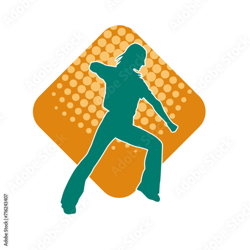 Silhouette of a female dancer in action pose. Silhouette of a woman dancing happily.