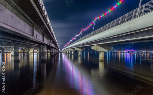 A view between the two road sections of the Sundale Bridge with lights and reflections at night on the Gold Coast in Queensland, Australia. © Shirley and Johan