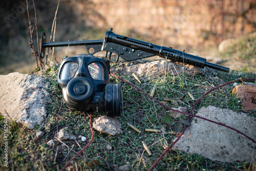 gas mask and sten gun  photo