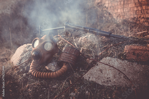 gas mask and sten gun  photo