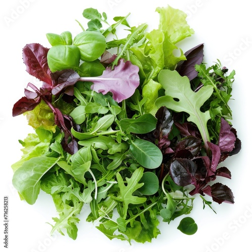 Mesclun mix, a blend of various baby salad leaves isolated on white background
