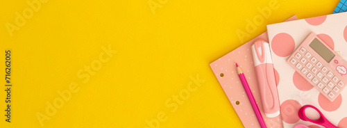 School stationery on a yellow background. Top view with copy space. Back to school concept.